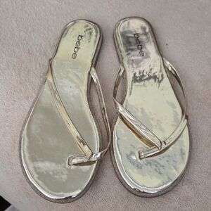 Bebe Gold Shiny Flip Flops